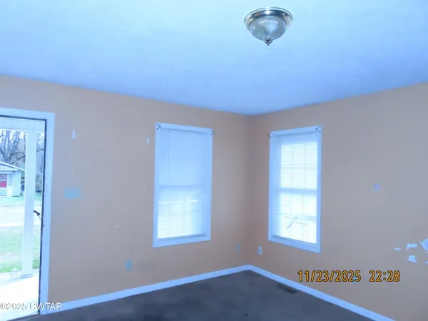 an empty room with windows