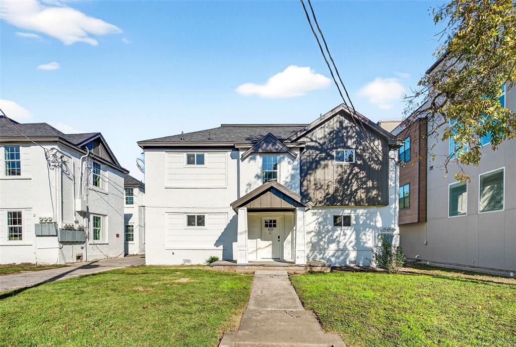 439 West 9th Street, Unit 2 Dallas, TX 75208 - Photo 2 of 25 a front view of a house with a yard and garage
