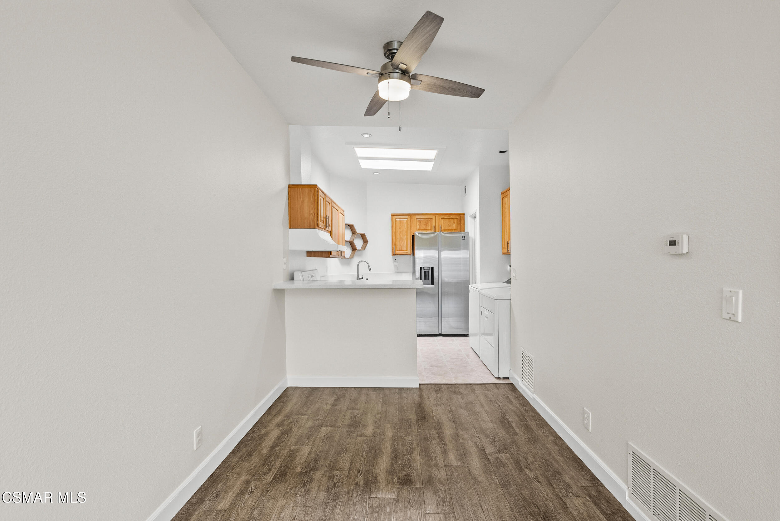 2930 Isle Way, Unit B Oxnard, CA 93035 - Photo 13 of 35 a view of kitchen with sink and wooden floor