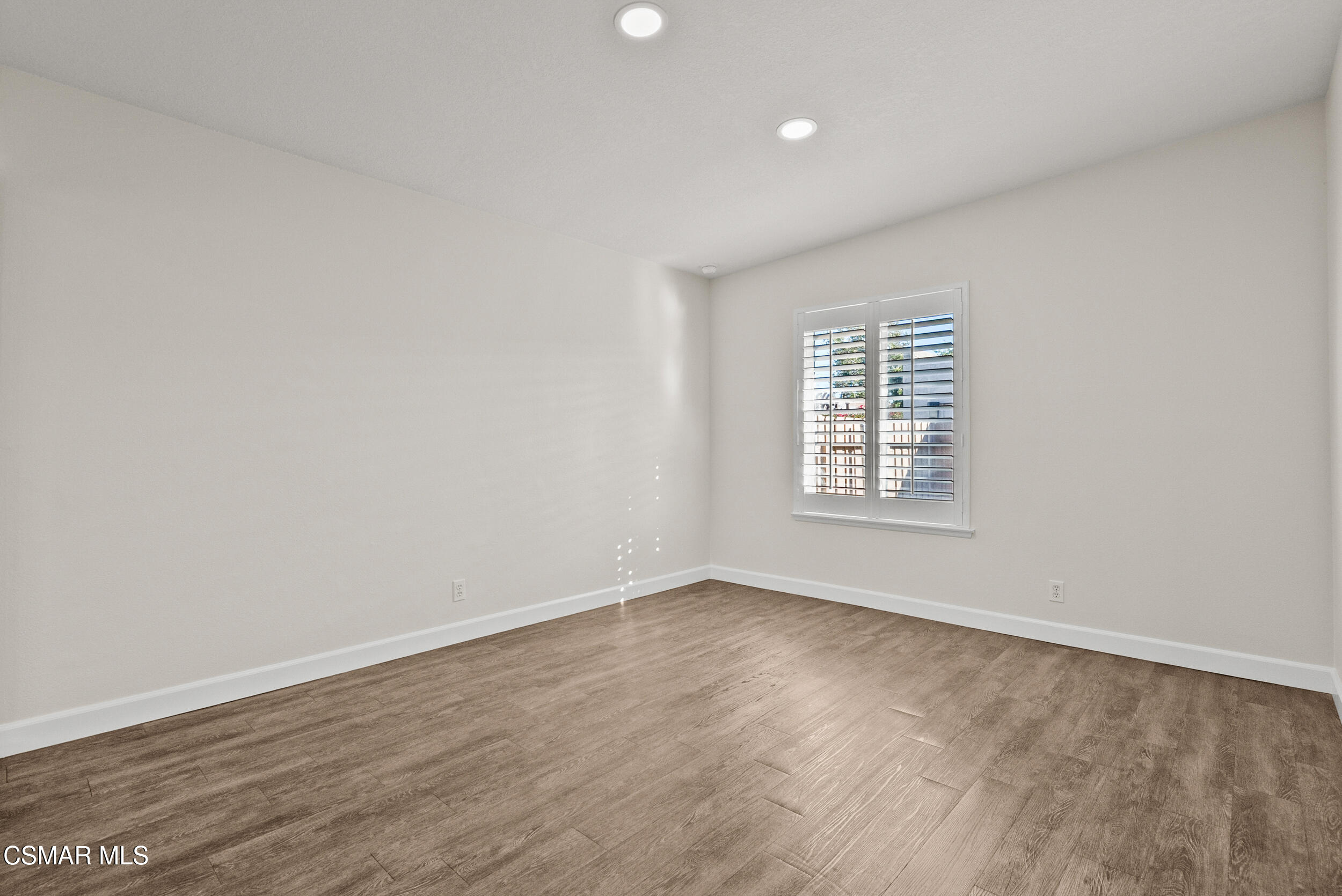 2930 Isle Way, Unit B Oxnard, CA 93035 - Photo 18 of 35 wooden floor in an empty room with a window
