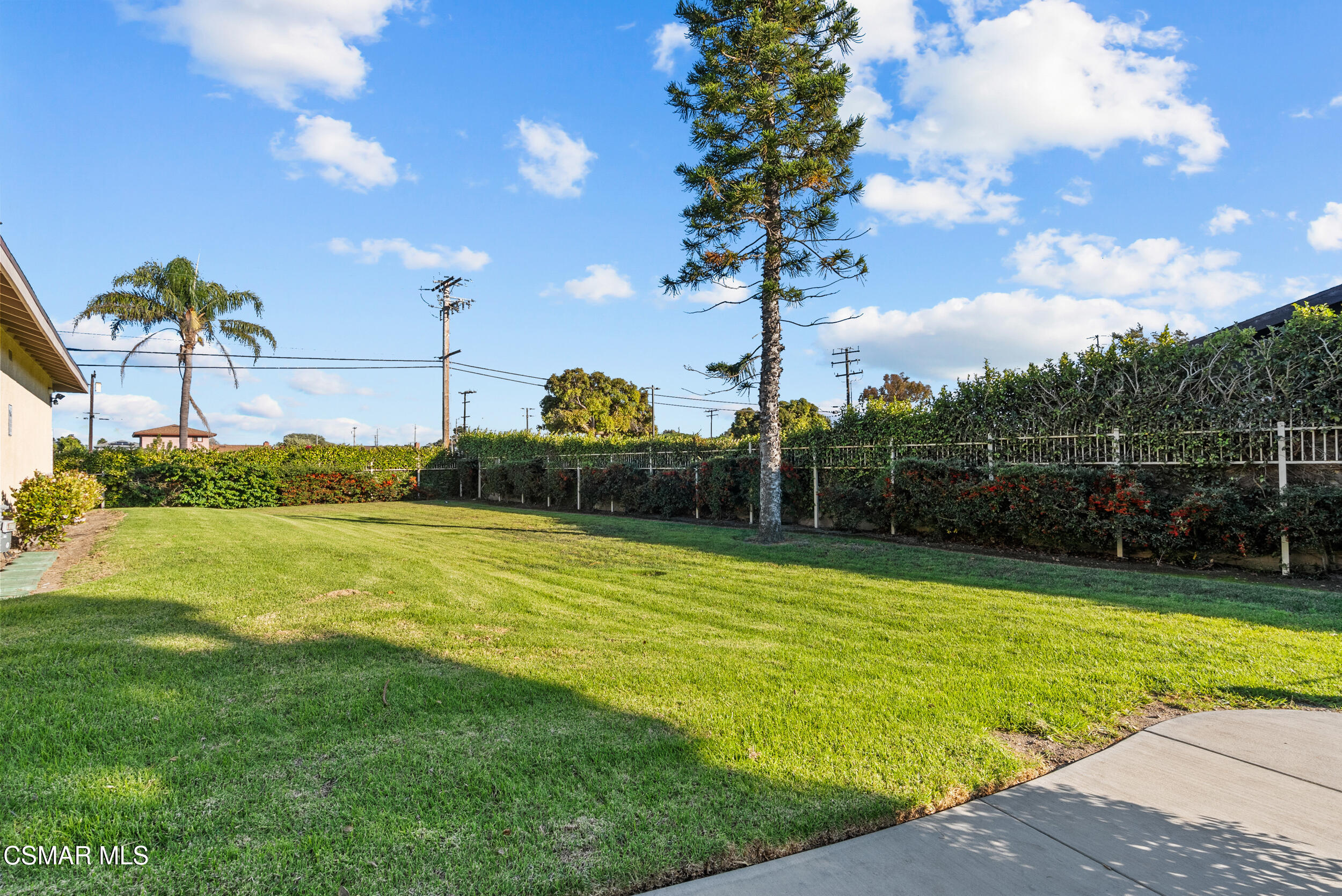 2930 Isle Way, Unit B Oxnard, CA 93035 - Photo 30 of 35 a view of a swimming pool with a yard