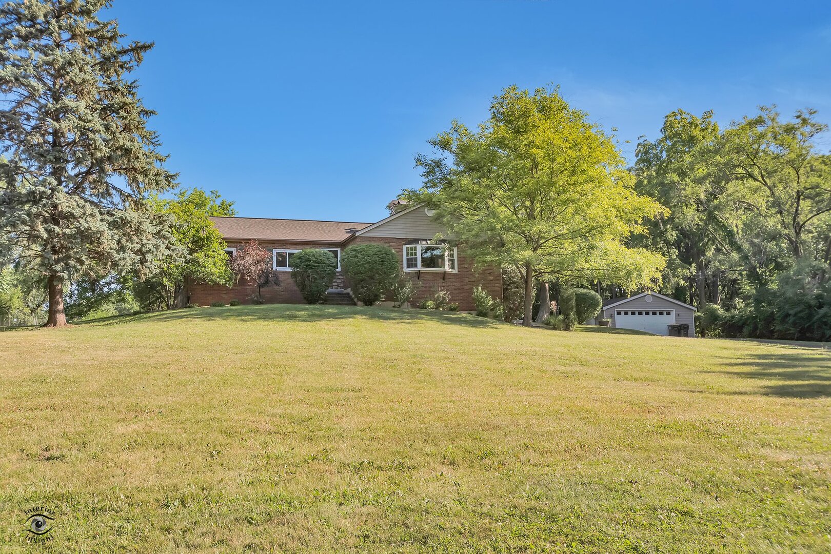 17332 Bluff Road Lemont, IL 60439 - Photo 1 of 18 a view of a large pool with some trees in the background