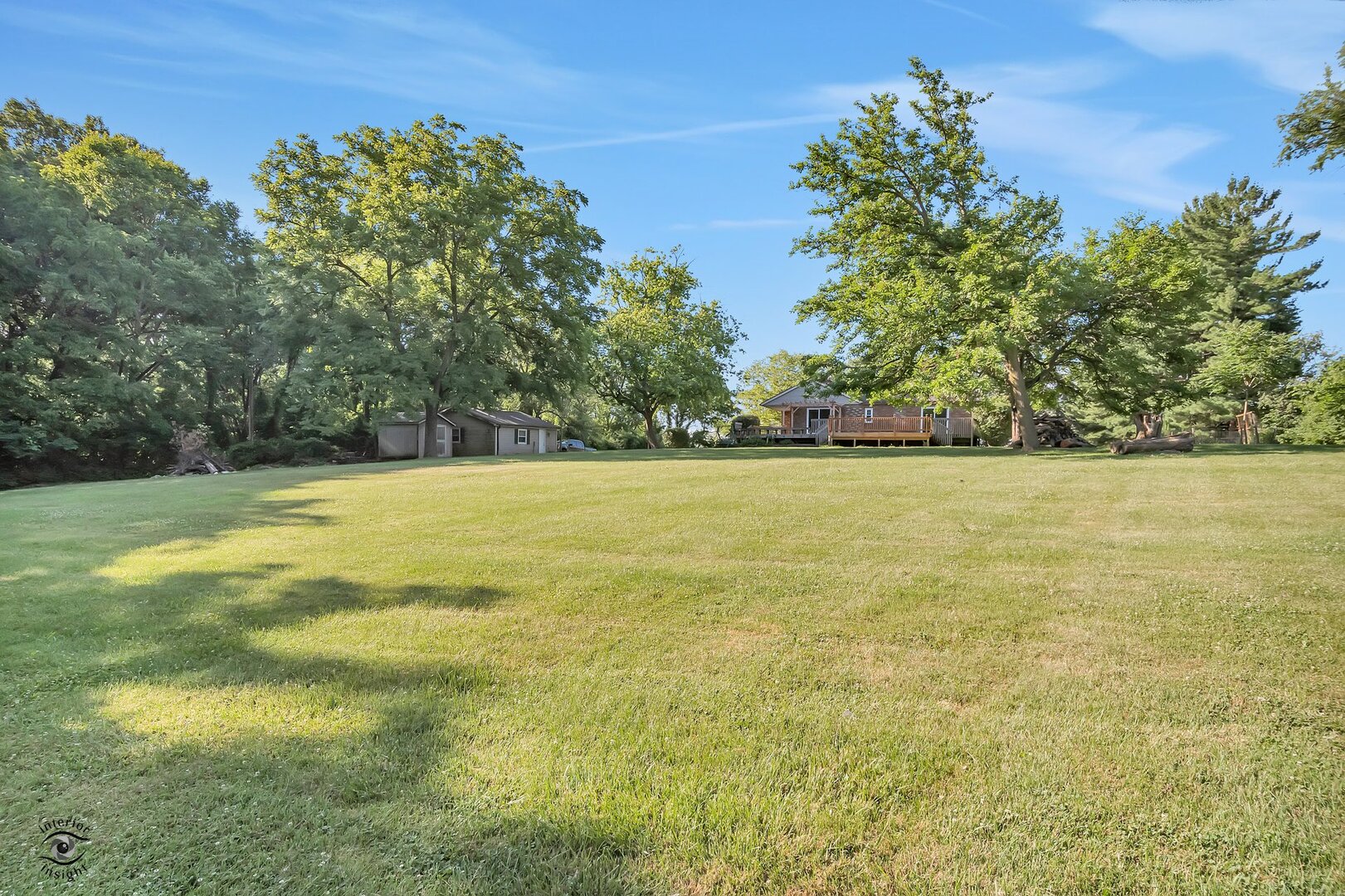 17332 Bluff Road Lemont, IL 60439 - Photo 14 of 18 a view of a green yard with a tree