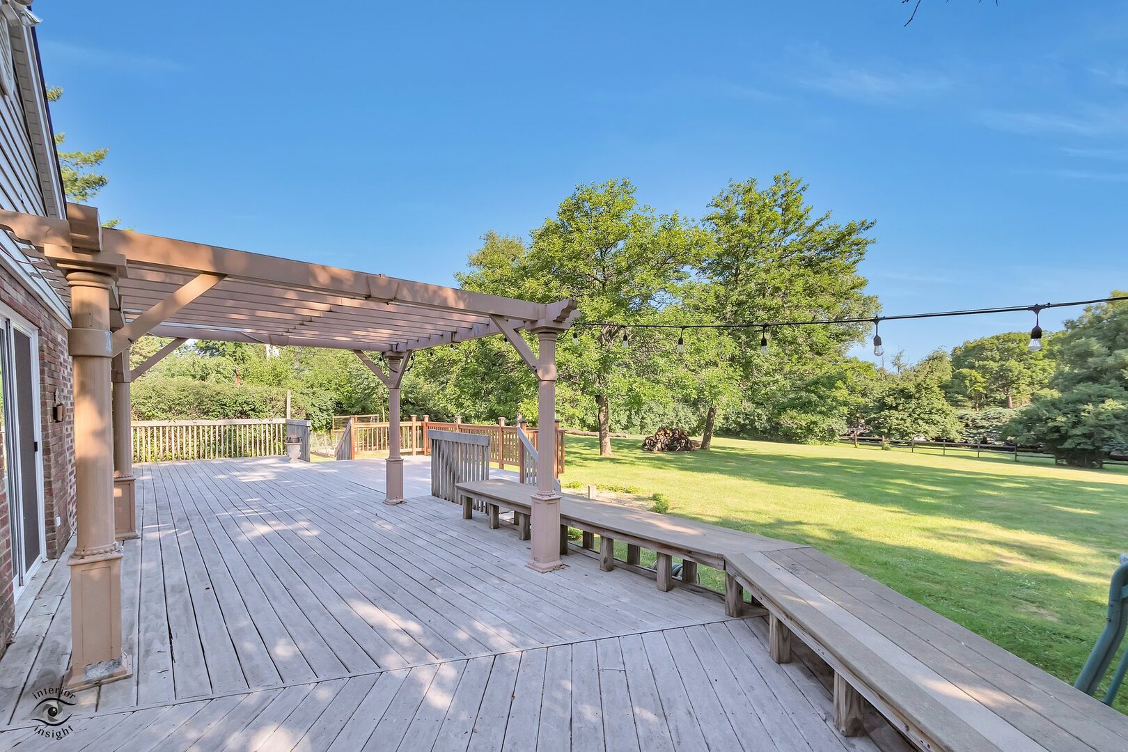 17332 Bluff Road Lemont, IL 60439 - Photo 9 of 18 a view of a patio with lawn chairs under an umbrella
