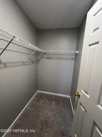 a view of room with racks on the wall