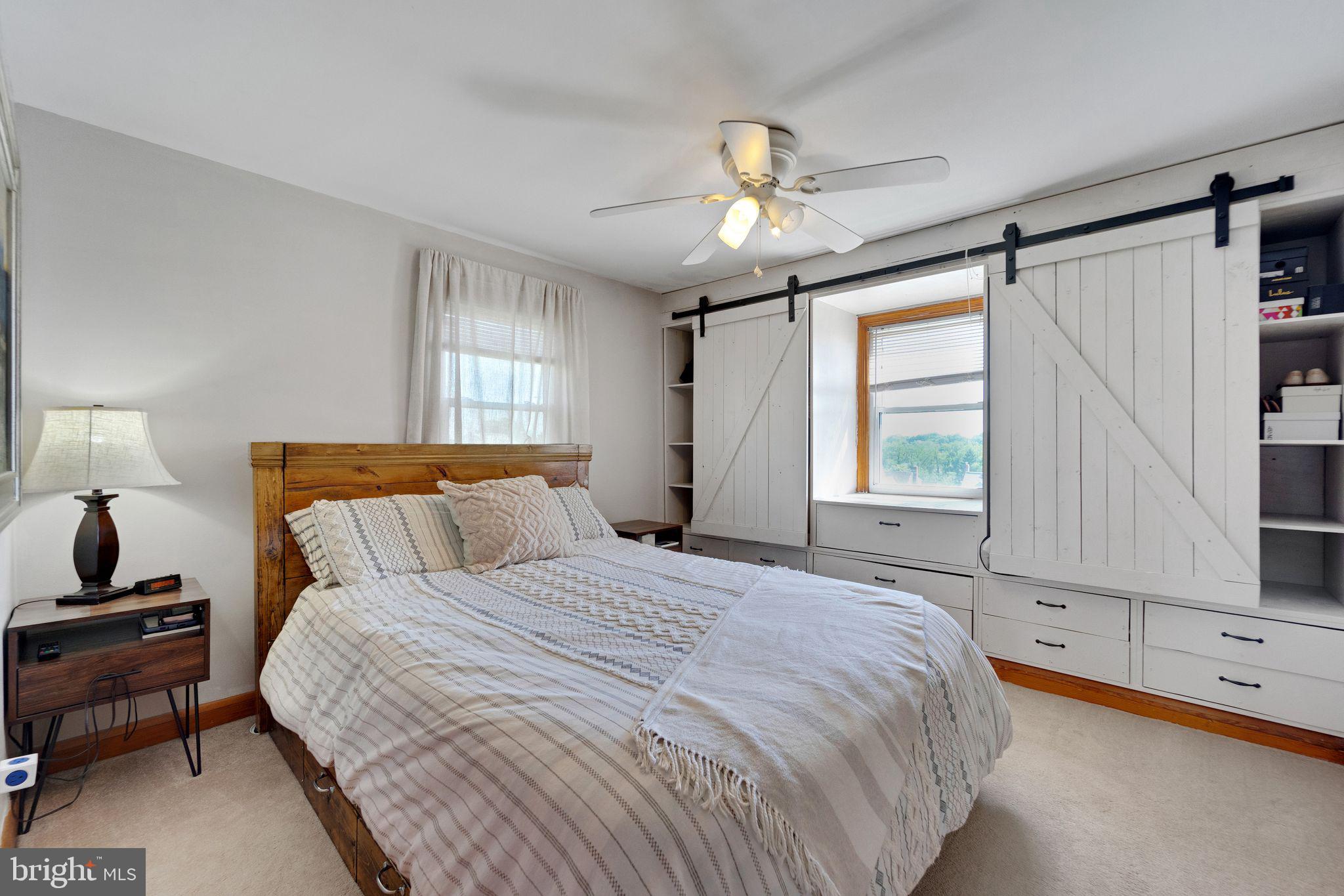 1251 Oakland Terrace Road Halethorpe, MD 21227 - Photo 12 of 34 a bedroom with a bed and a flat tv screen on dresser