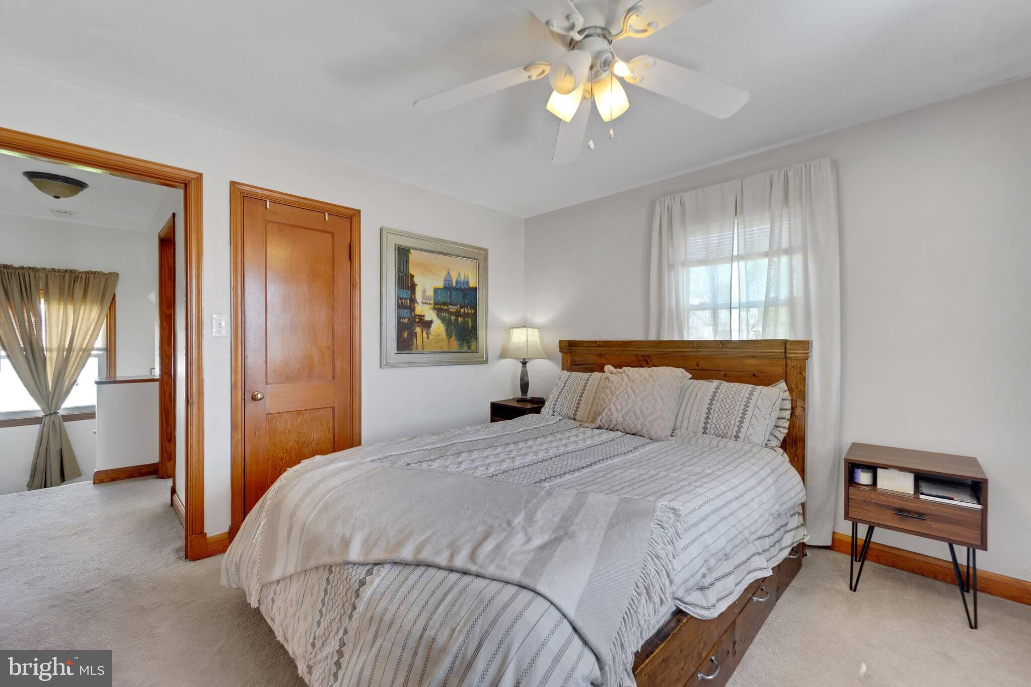 1251 Oakland Terrace Road Halethorpe, MD 21227 - Photo 13 of 34 a bedroom with a bed and a chandelier