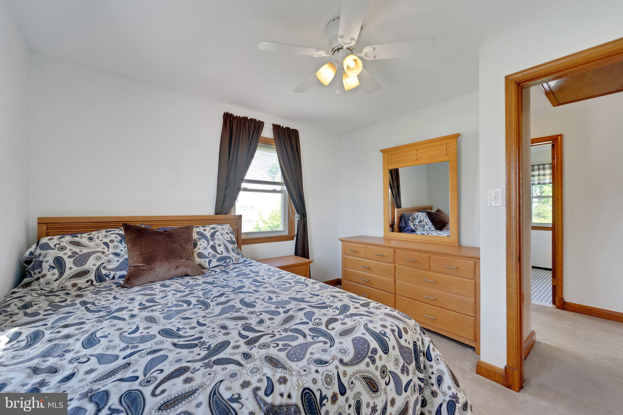 1251 Oakland Terrace Road Halethorpe, MD 21227 - Photo 14 of 34 a bedroom with a bed and a dresser