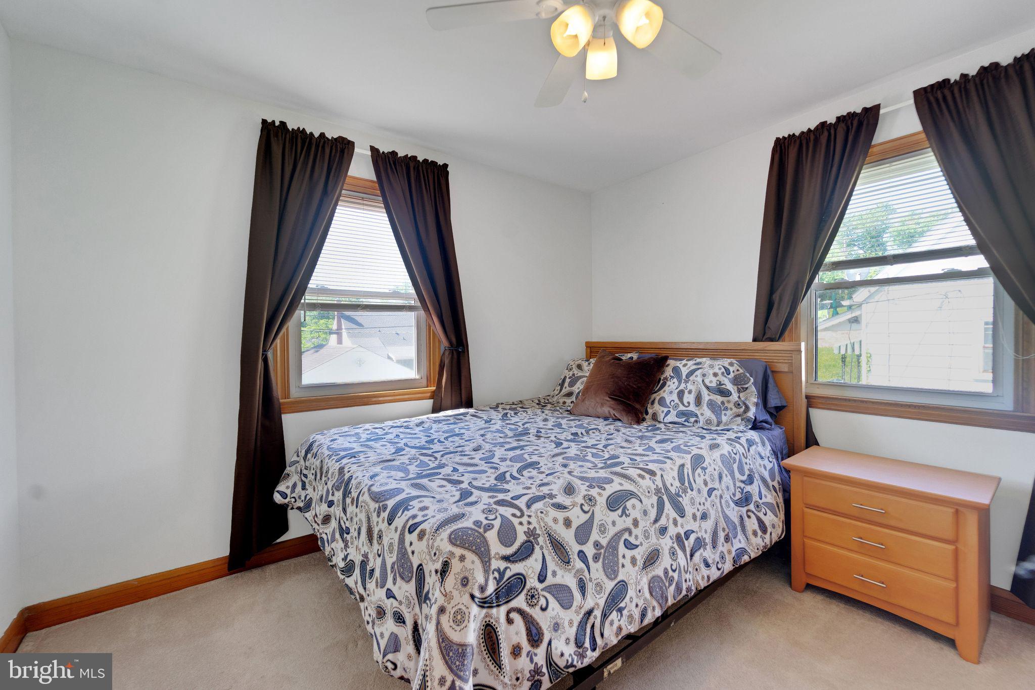 1251 Oakland Terrace Road Halethorpe, MD 21227 - Photo 15 of 34 a bedroom with a bed and a window