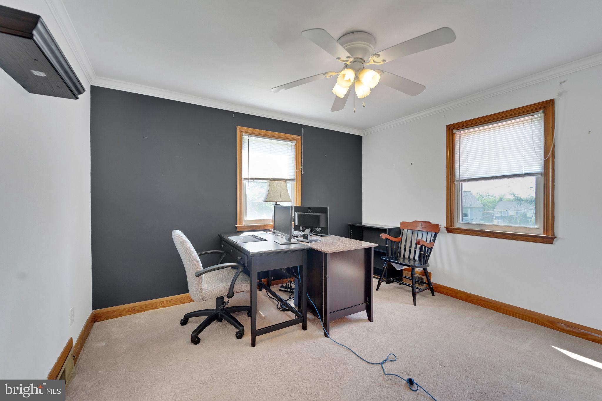 1251 Oakland Terrace Road Halethorpe, MD 21227 - Photo 16 of 34 a view of a workspace with furniture and a chandelier