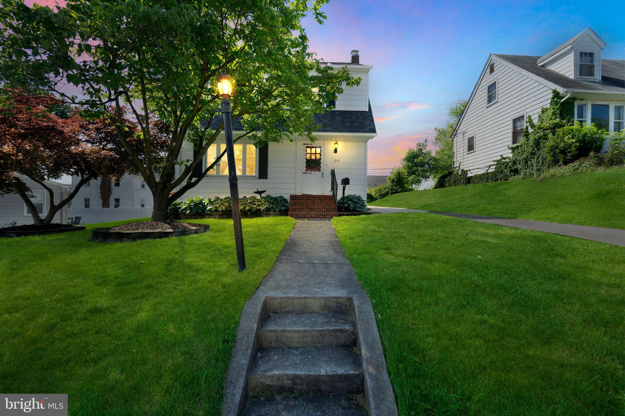 1251 Oakland Terrace Road Halethorpe, MD 21227 - Photo 34 of 34 a front view of a house with garden