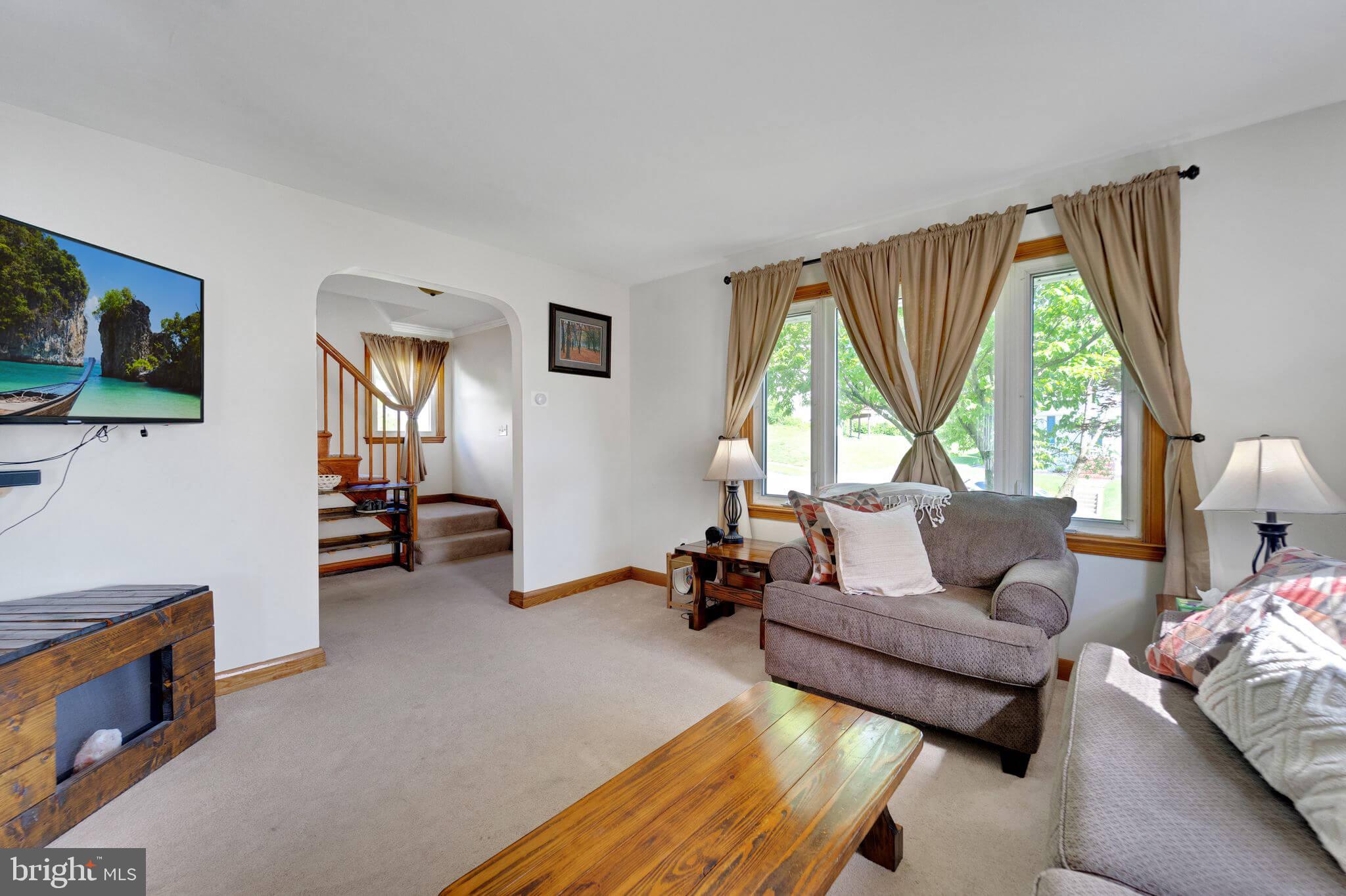 1251 Oakland Terrace Road Halethorpe, MD 21227 - Photo 4 of 34 a living room with furniture and a large window