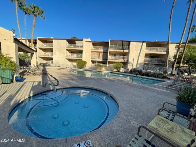 a view of living room kitchen with furniture and flat screen tv