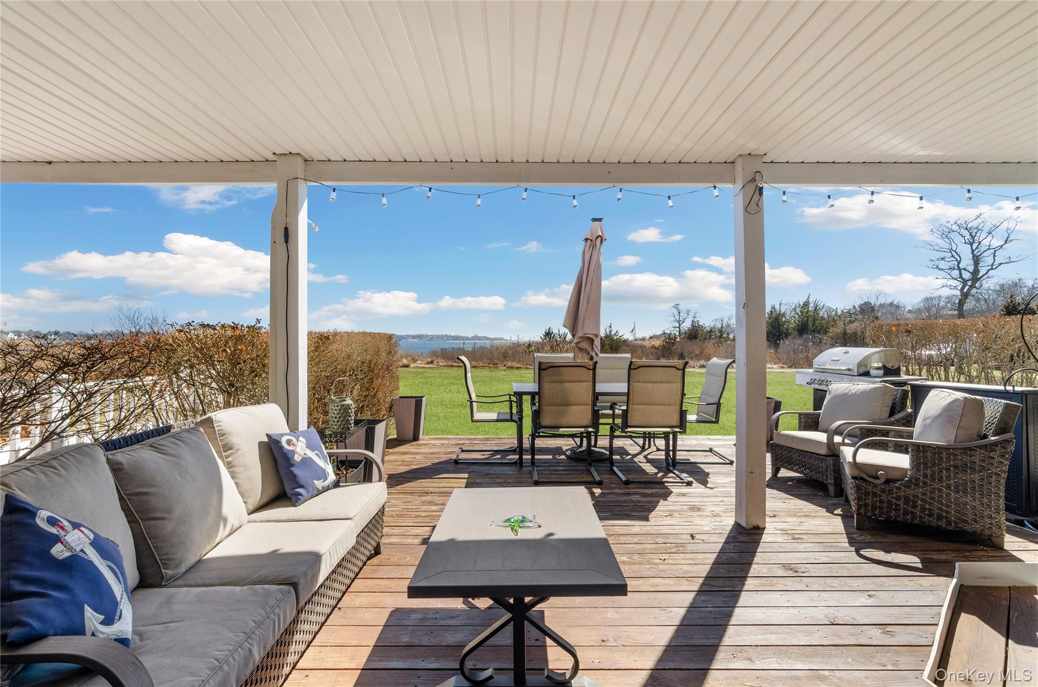 61 West Tiana Road, Unit 10 Hampton Bays, NY 11946 - Photo 15 of 28 Spacious outdoor area