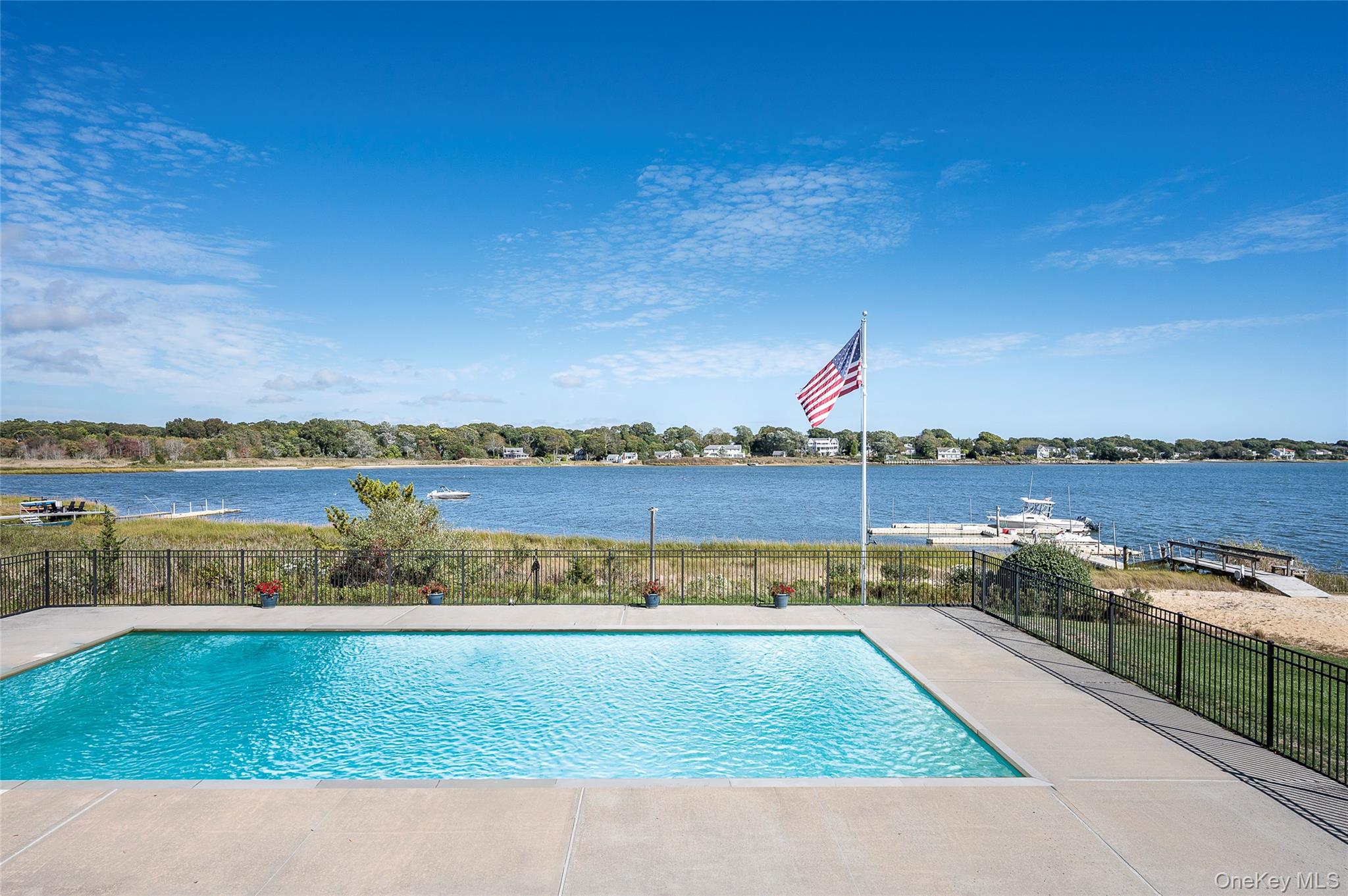 61 West Tiana Road, Unit 10 Hampton Bays, NY 11946 - Photo 18 of 28 Heated, chlorine pool