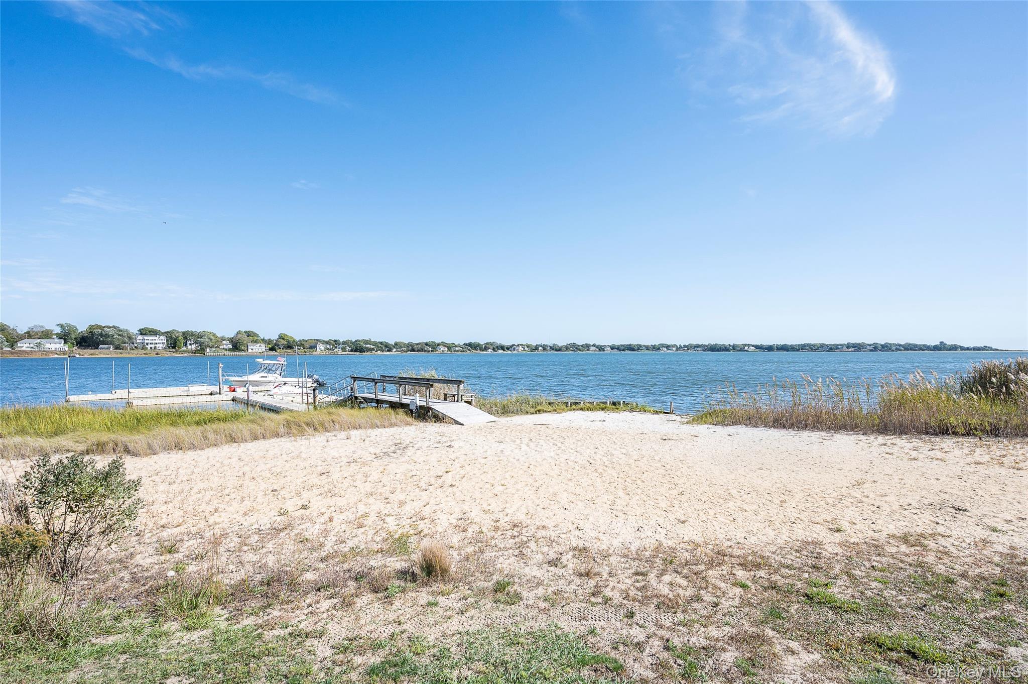 61 West Tiana Road, Unit 10 Hampton Bays, NY 11946 - Photo 19 of 28 Sandy beach overlooking Tiana Bay