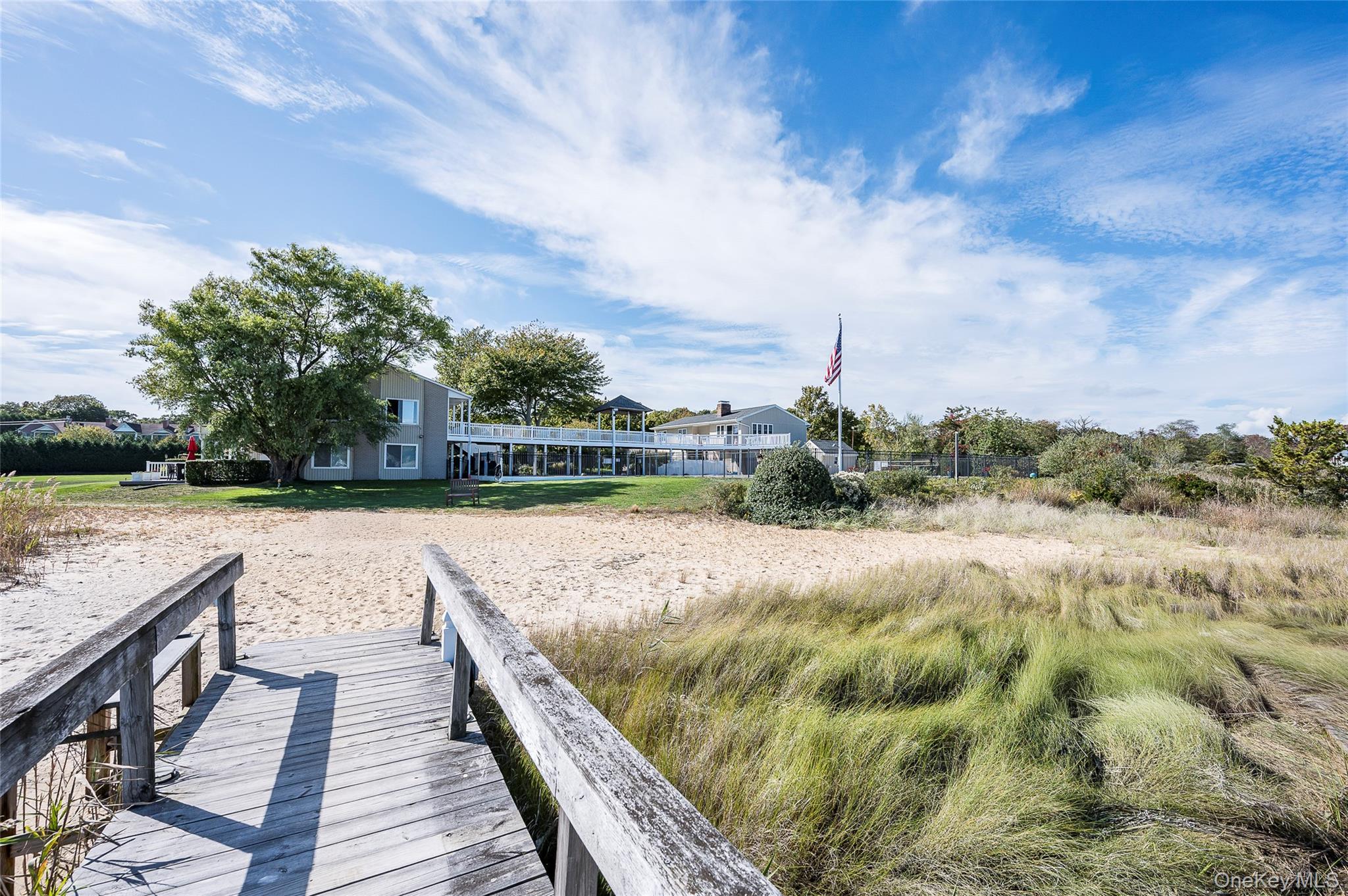 61 West Tiana Road, Unit 10 Hampton Bays, NY 11946 - Photo 23 of 28 View of the complex from the beach