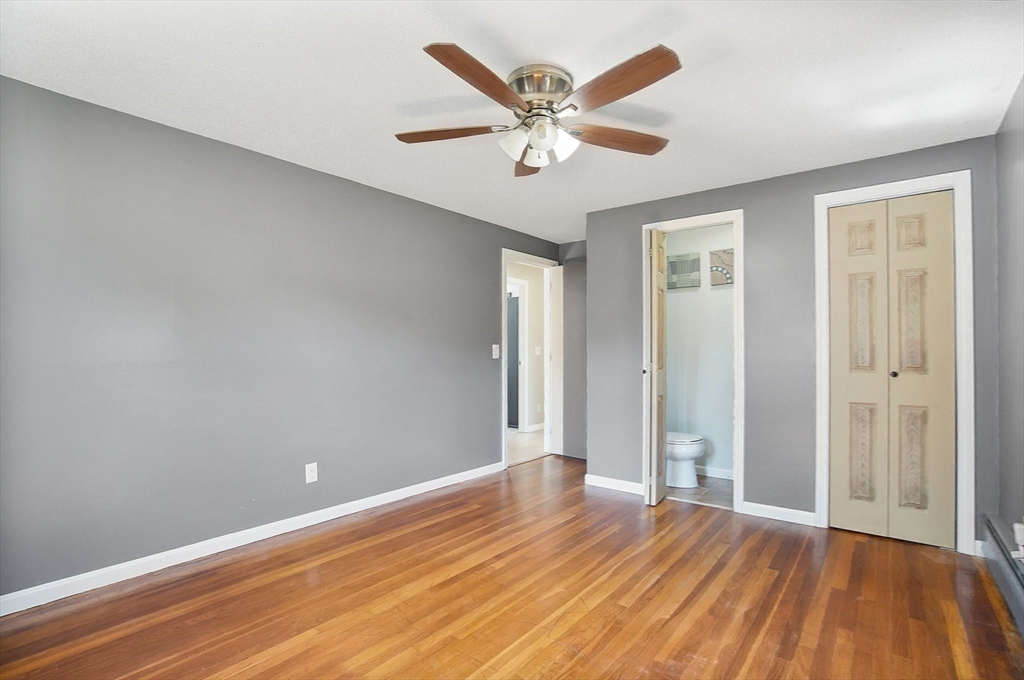 627 Morgan Road West Springfield, MA 01089 - Photo 23 of 41 an empty room with wooden floor and windows