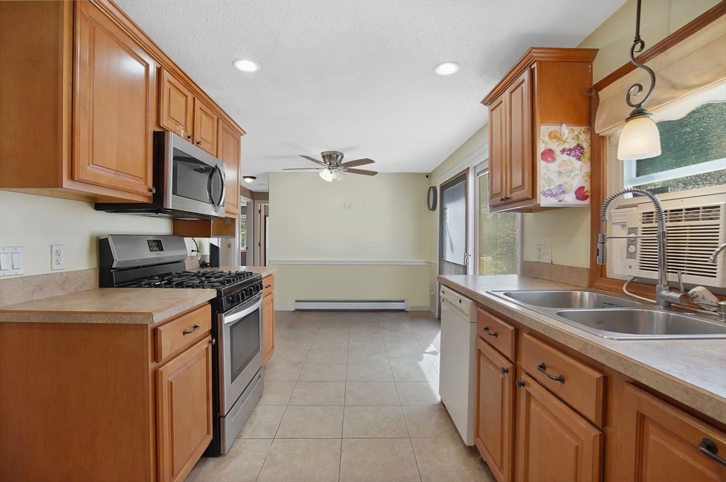 627 Morgan Road West Springfield, MA 01089 - Photo 8 of 41 a kitchen with stainless steel appliances granite countertop a sink and a stove