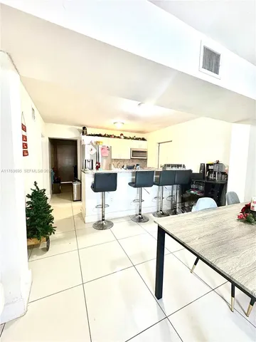 a terrace with a table and chairs