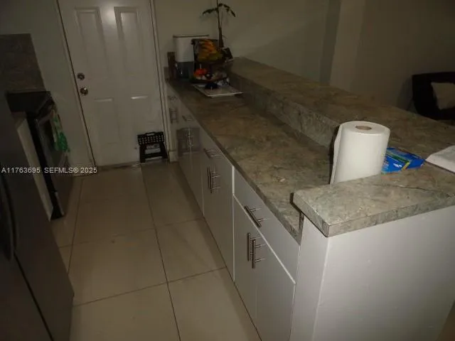 a kitchen with a sink a washer and dryer