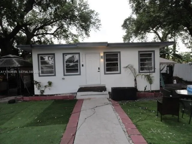 a front view of house with yard