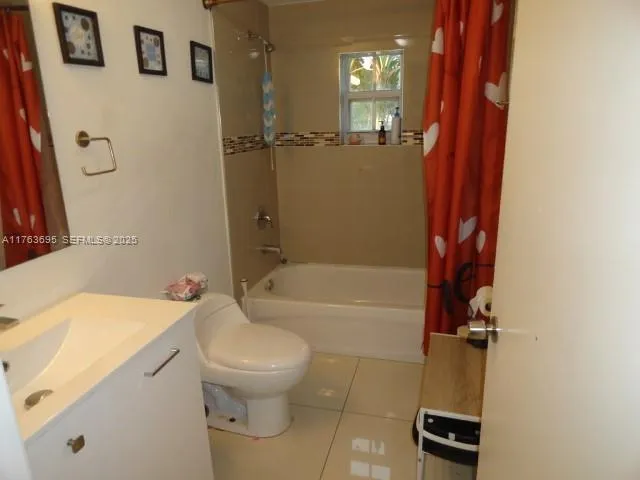 a bathroom with a toilet sink and tub