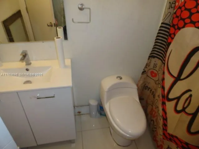 a bathroom with a toilet and a sink