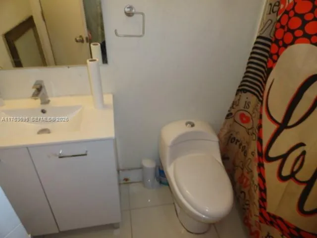 a bathroom with a toilet and a sink