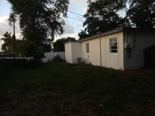 a house with trees in the background