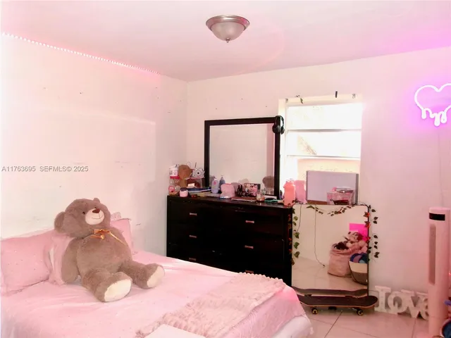 a bed room with a bed and a dresser