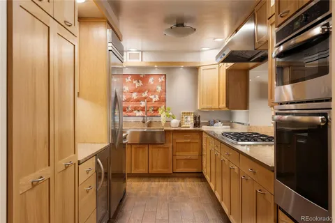 a kitchen with granite countertop a sink and a window