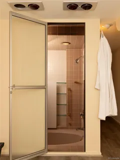 a bedroom with a bed and a cabinets