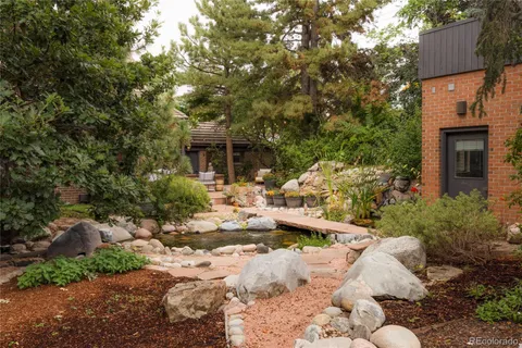 a backyard of a house with outdoor seating
