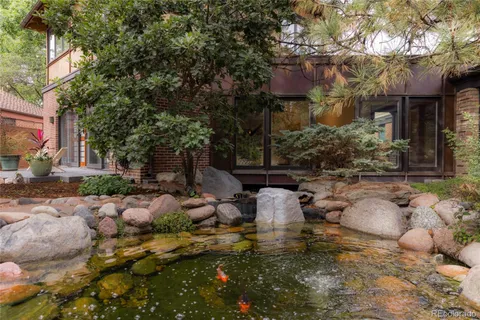 a view of a swimming pool with a yard