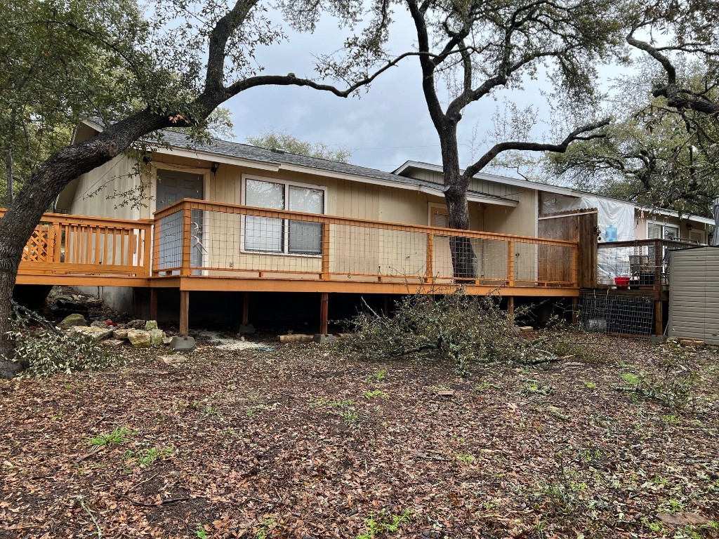 a view of a white house with large windows