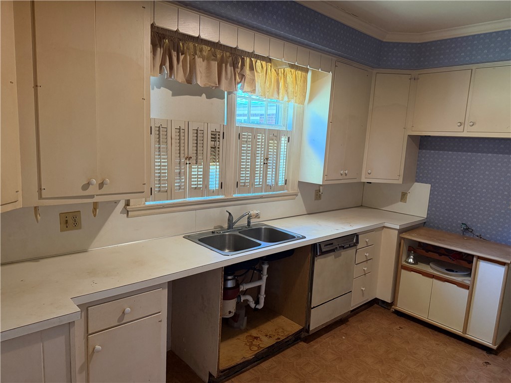 715 Concord Road Anderson, SC 29621 - Photo 16 of 24 A functional kitchen space offers a double sink and ample cabinet storage.