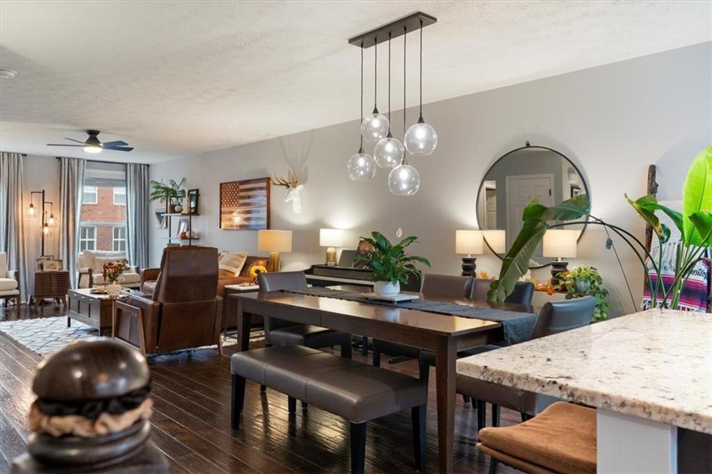 1507 Federal Street Pittsburgh, PA 15212 - Photo 11 of 45 a living room with furniture a chandelier and a dining table