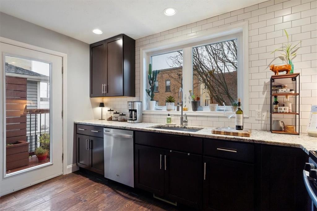 1507 Federal Street Pittsburgh, PA 15212 - Photo 17 of 45 a kitchen with a sink and wooden cabinets