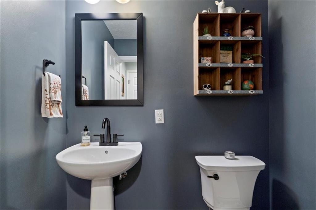 1507 Federal Street Pittsburgh, PA 15212 - Photo 18 of 45 a bathroom with a toilet sink and mirror
