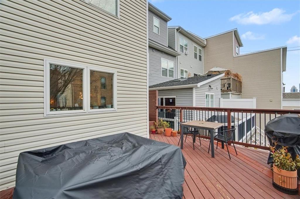 1507 Federal Street Pittsburgh, PA 15212 - Photo 38 of 45 a balcony with furniture and wooden floor