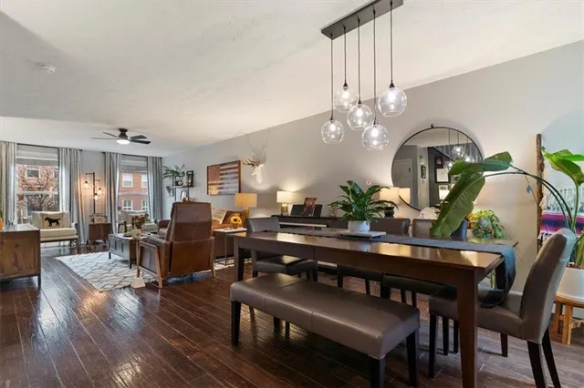 a view of a dining room with furniture and wooden floor