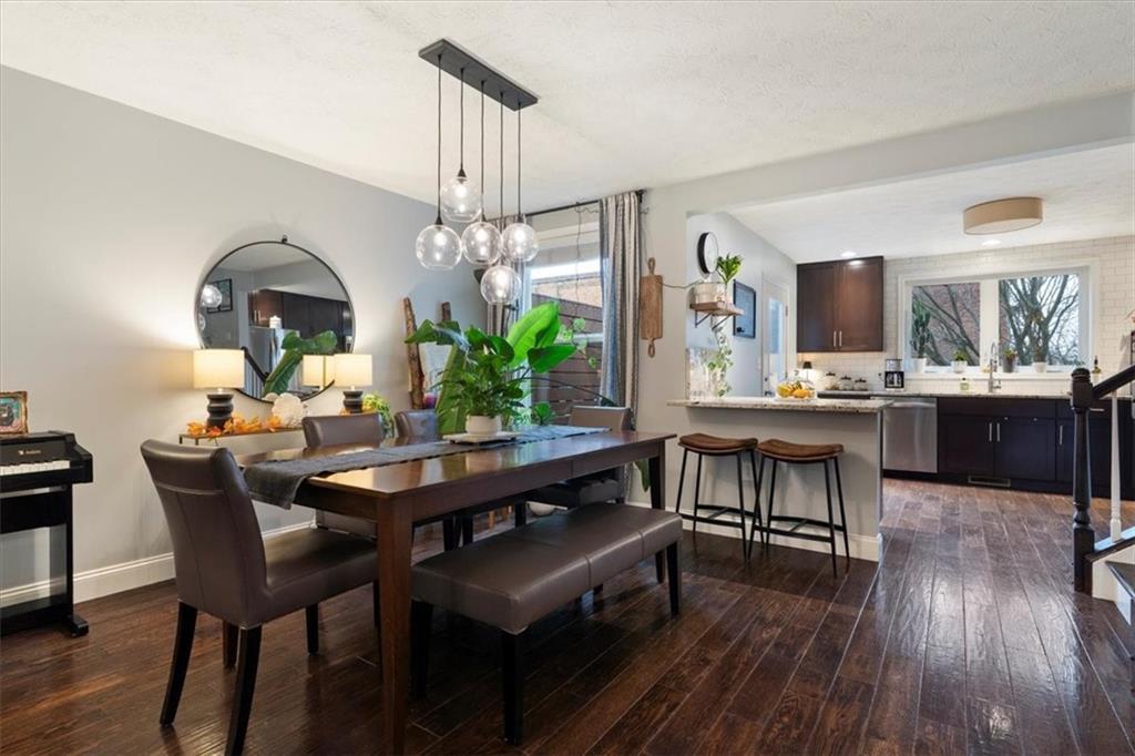 1507 Federal Street Pittsburgh, PA 15212 - Photo 9 of 45 a dining room with a table chairs and a kitchen view