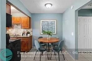 a view of a dining room with furniture and window
