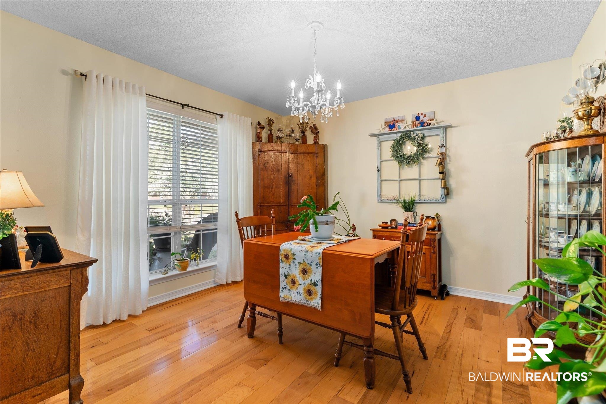 356 Collinwood Loop Foley, AL 36535 - Photo 5 of 21 Dining room with a chandelier, a textured ceiling, and light hardwood / wood-style flooring