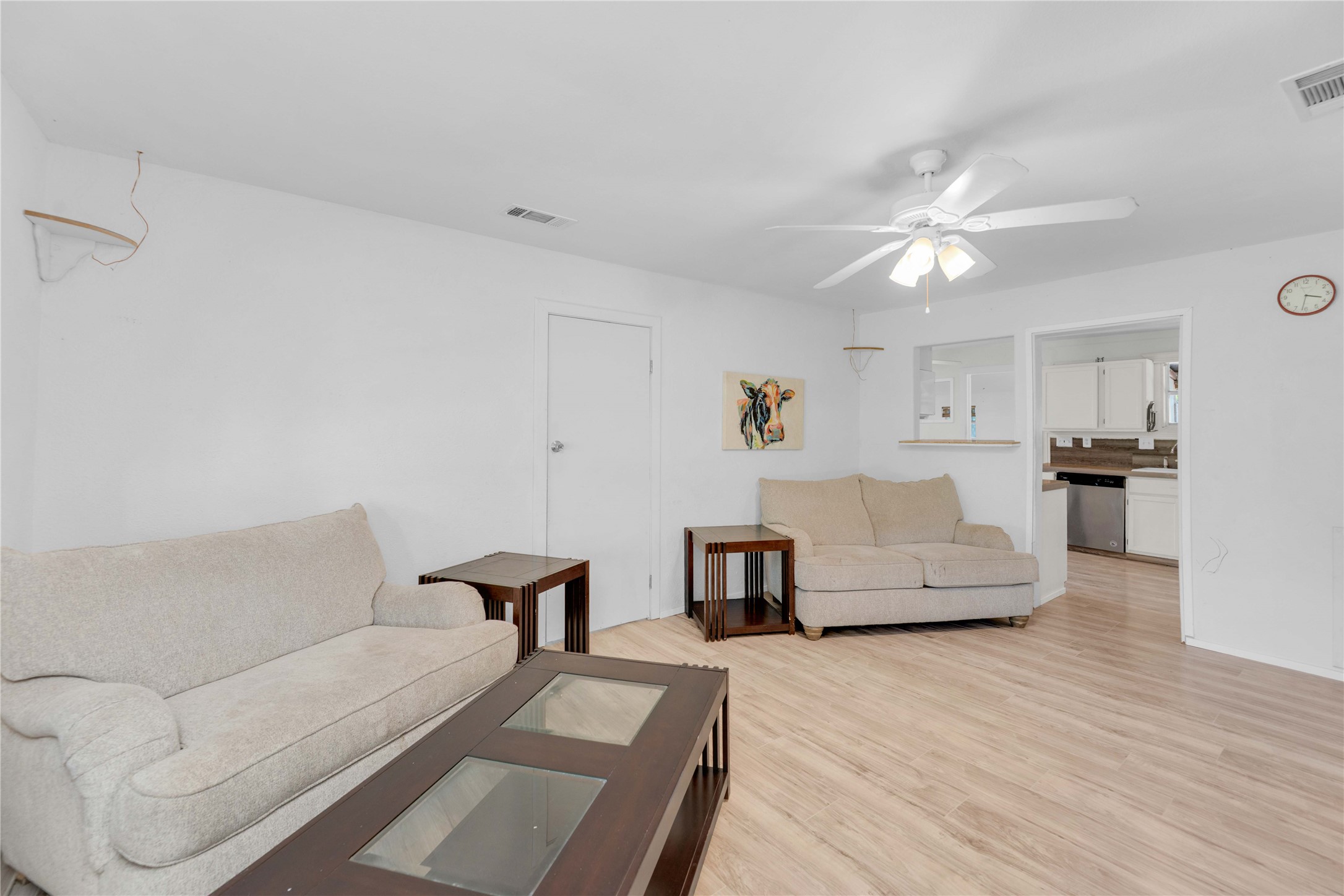 20235 Engelmann Lane Manor, TX 78653 - Photo 5 of 34 Living room featuring light wood finished floors and ceiling fan