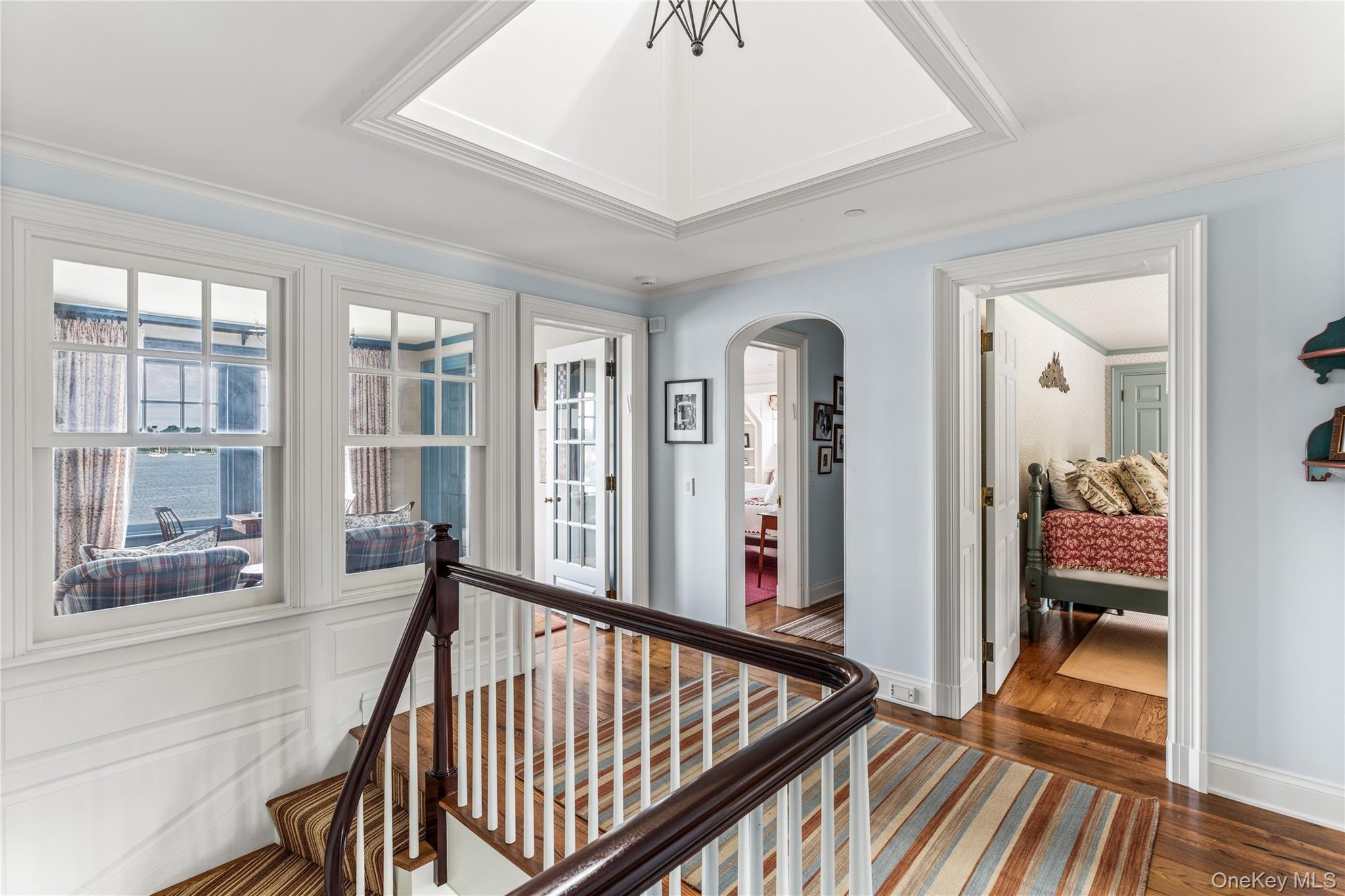75 Cove Neck Road Cove Neck, NY 11771 - Photo 24 of 40 a view of a hallway with a livingroom with furniture
