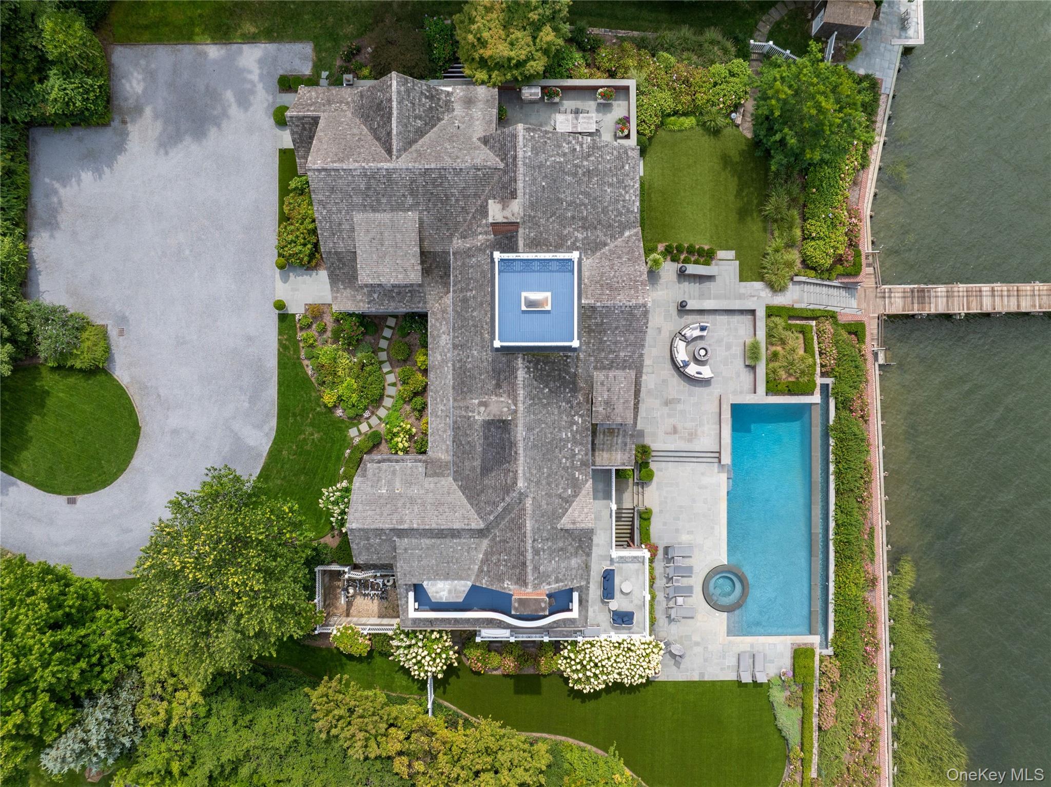 75 Cove Neck Road Cove Neck, NY 11771 - Photo 36 of 40 an aerial view of a house with outdoor space pool seating area and yard