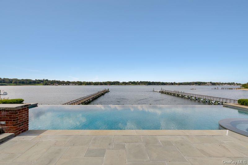 75 Cove Neck Road Cove Neck, NY 11771 - Photo 38 of 40 a view of a lake with a outdoor space