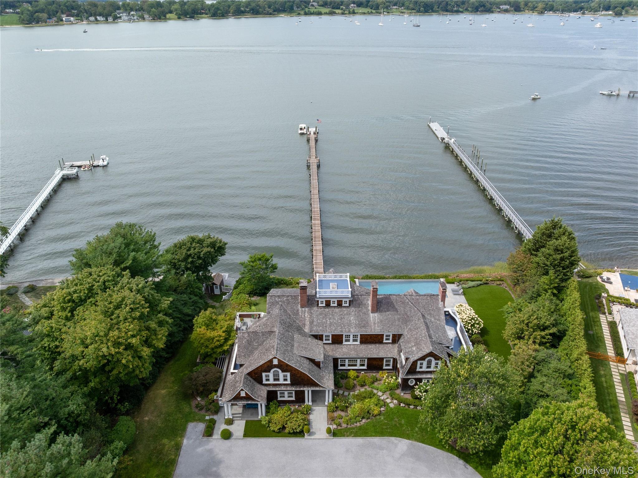 75 Cove Neck Road Cove Neck, NY 11771 - Photo 39 of 40 a aerial view of a house with a garden and plants